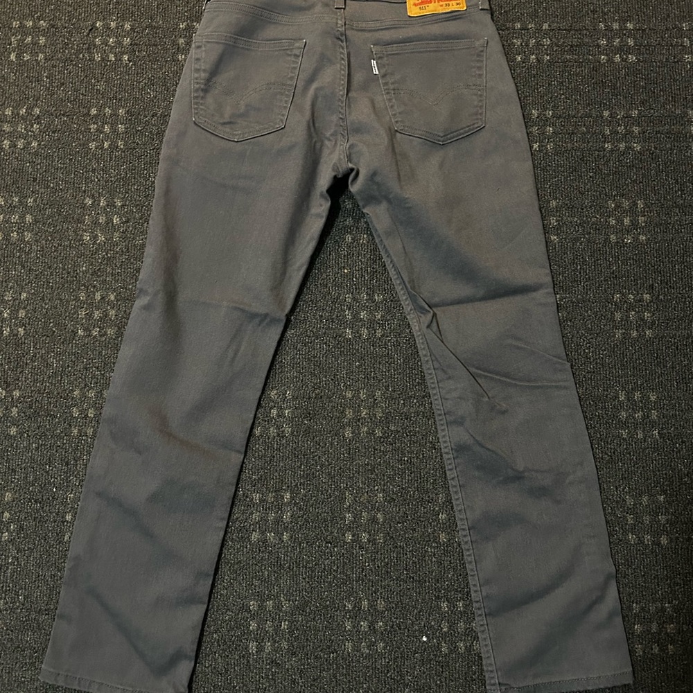 Never worn Levils slim fit pants. Perfect condition